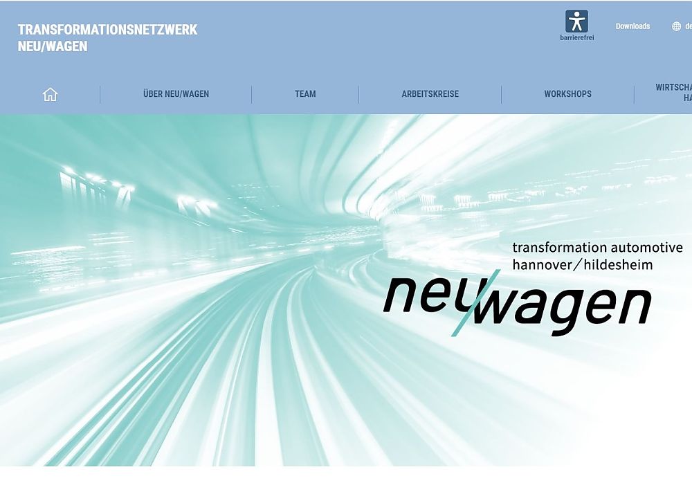 „Screenshot der Website Transformationsnetzwerk Neu/Wagen mit Navigationsmenu, Tunnelbild und Logo auf Türkishintergrund."
